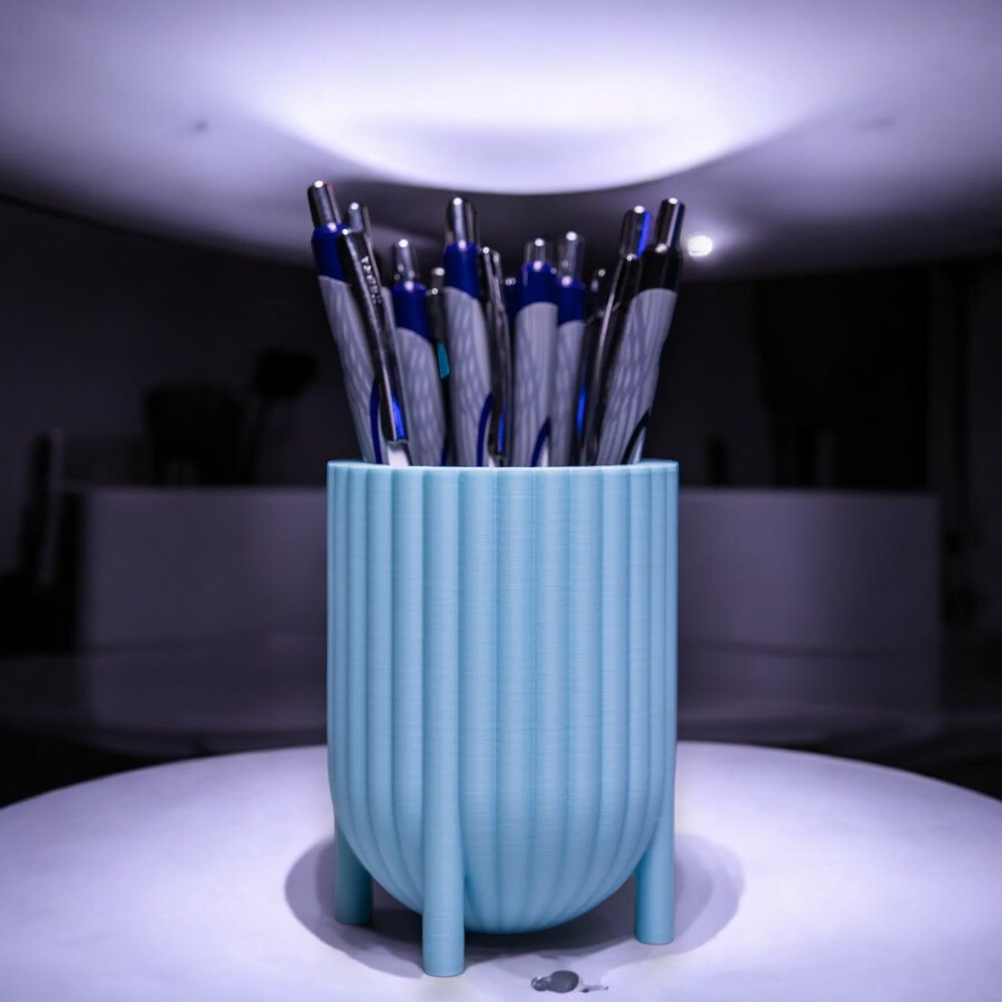 Charming pen holder named Elysian Grace Cup, featuring small feet for a playful touch. Available in various colours, this elegant organizer adds style and functionality to any desk or workspace