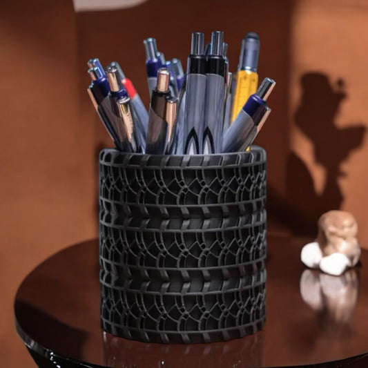 A pencil holder designed to resemble stacked car tires, combining practicality with a distinctive automotive-inspired look. Perfect for car enthusiasts and unique desk setups