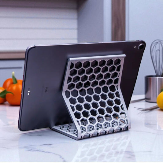 Honeycomb Stand: A versatile and stylish stand with a honeycomb pattern, designed to hold phones, tablets, and Kindles securely at an optimal viewing angle, blending functionality with modern design.