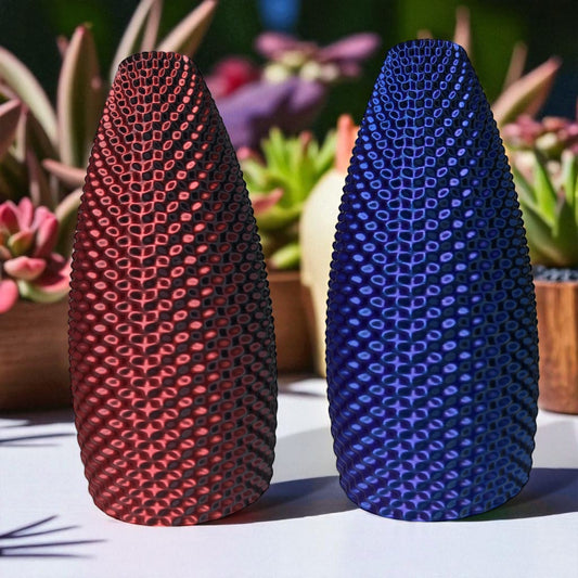 Limited edition color-shifting vase in red/black and purple/blue hues, 3D printed modern home decor piece that changes color with movement and light