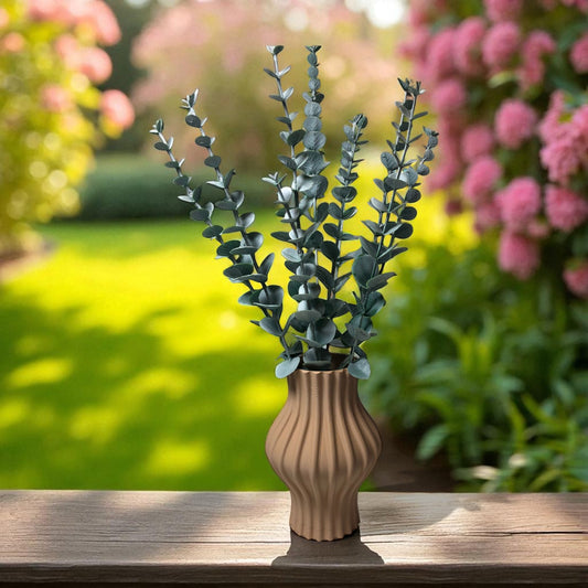 Modern 3D printed sculptural vase with wavy vertical grooves, shown in matte beige color on a white background – minimalist Nordic home decor centerpiece.