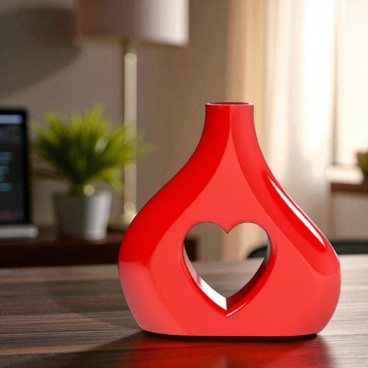 Asymmetric Vase A uniquely shaped vase featuring an asymmetric design with a heart-shaped cut out in the centre, perfect for adding a touch of charm to any space.