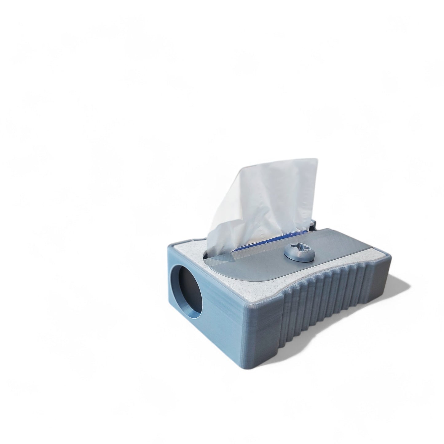 sharpener tissue box cover designed to resemble a classic pencil sharpener, made from durable 3d-printed material. fits standard tissue boxes, combining functionality with a quirky and creative design. perfect for home, office, or classroom decor