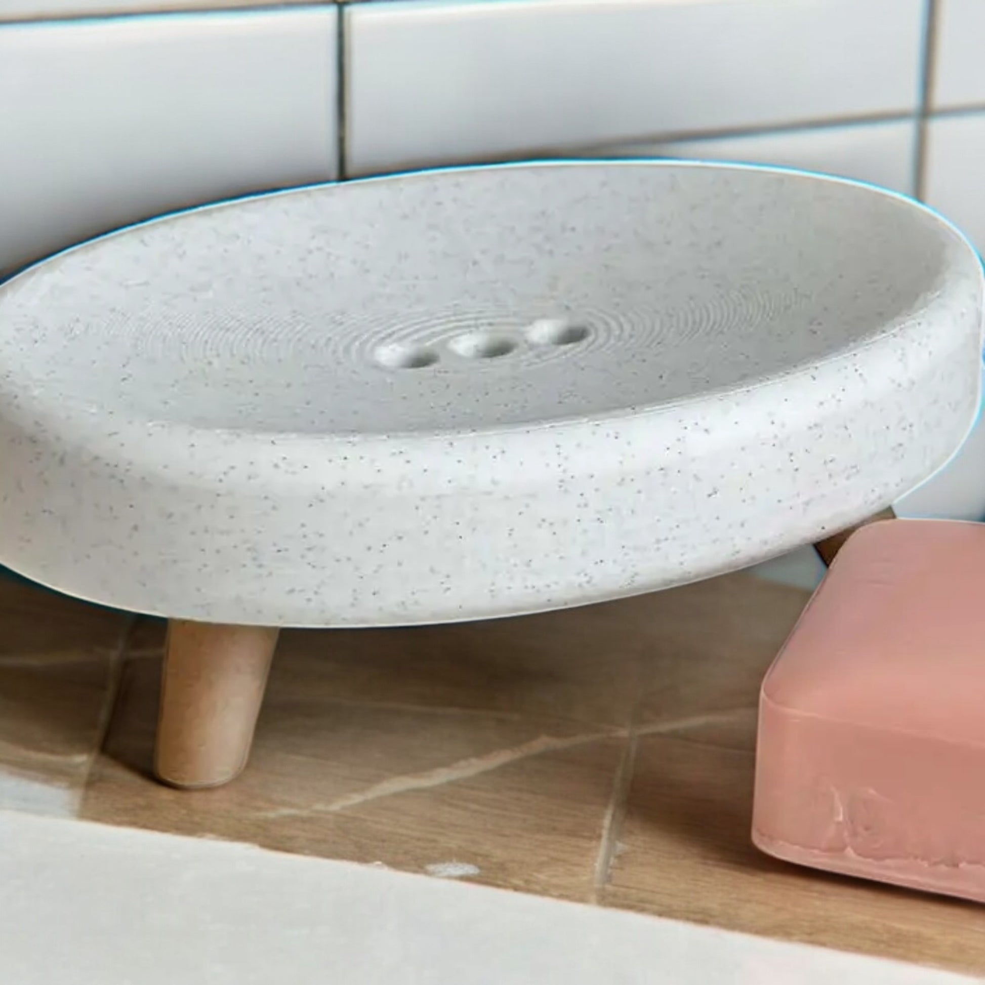 Soap holder with feet and drainage holes, made from durable eco-friendly material, featuring an elevated design to keep soap dry and fresh, perfect for bathrooms, kitchens, or laundry rooms.