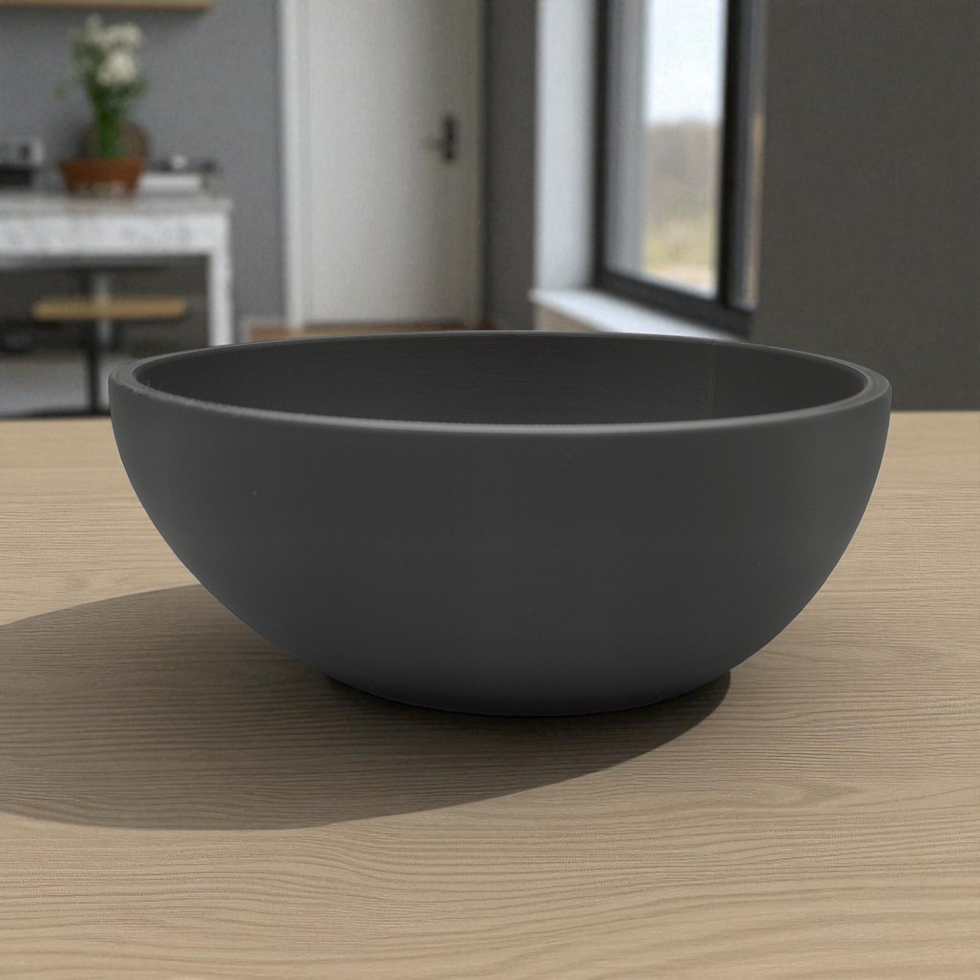 A uniquely designed bowl resembling a slightly crooked egg, perfect for use as a key holder, snack bowl, or fruit bowl, adding a touch of modern charm to any space.