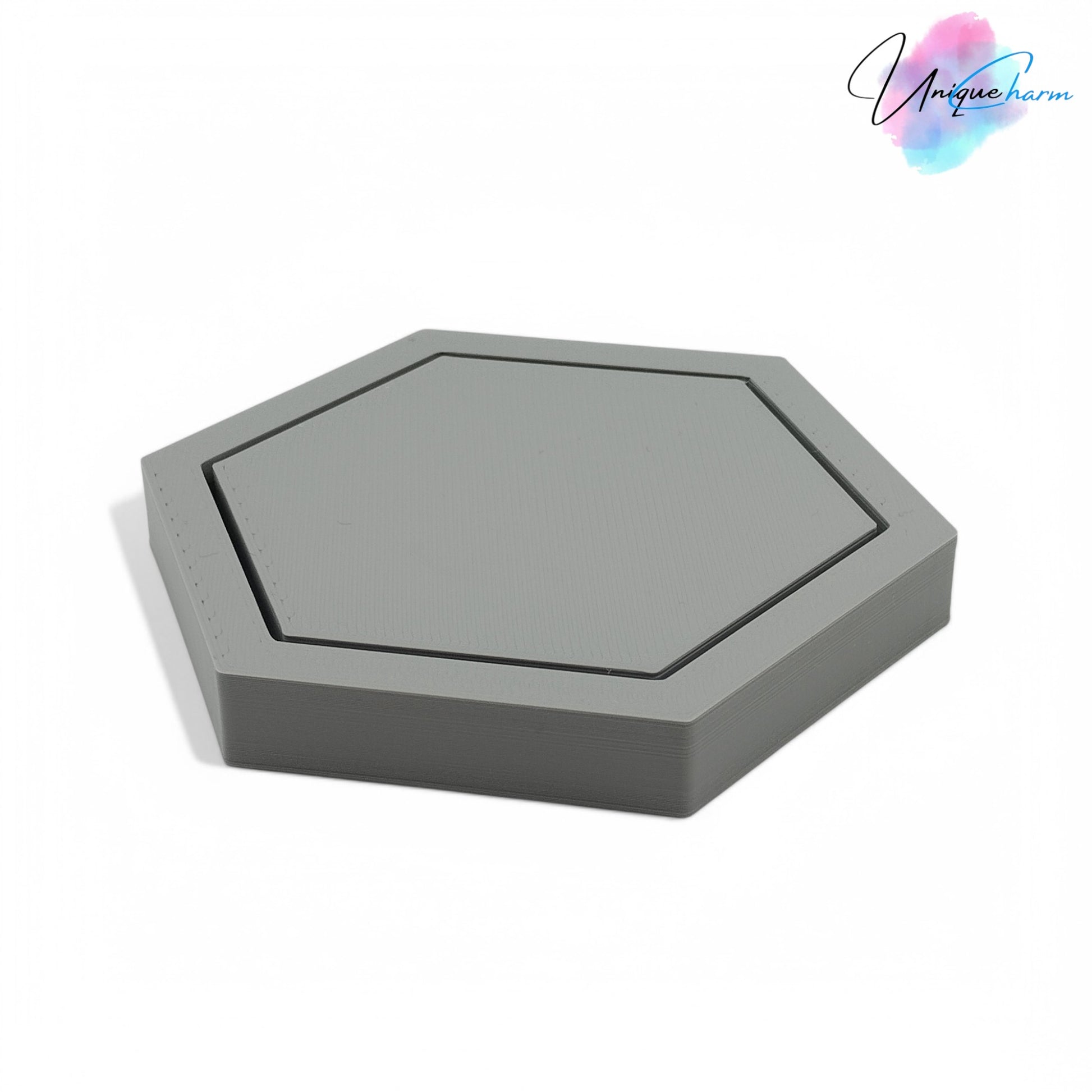 Modern hexagonal coaster in a minimalist design, measuring 115mm x 14mm, perfect for protecting surfaces from hot drinks. Available as a single piece, set of 4, or set of 6. Durable and stylish home decor accessory