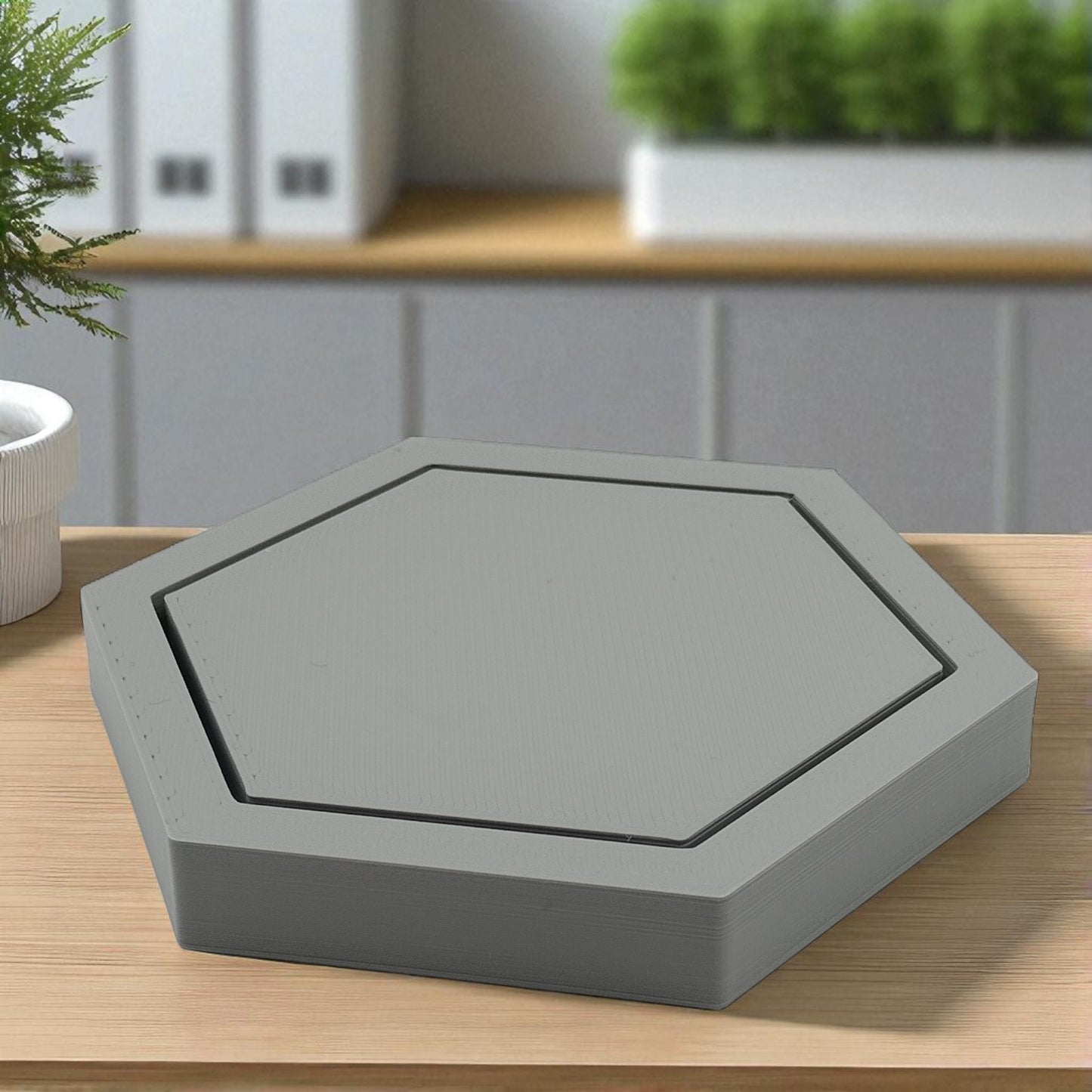 modern hexagonal coaster in a minimalist design, measuring 115mm x 14mm, perfect for protecting surfaces from hot drinks. available as a single piece, set of 4, or set of 6. durable and stylish home decor accessory