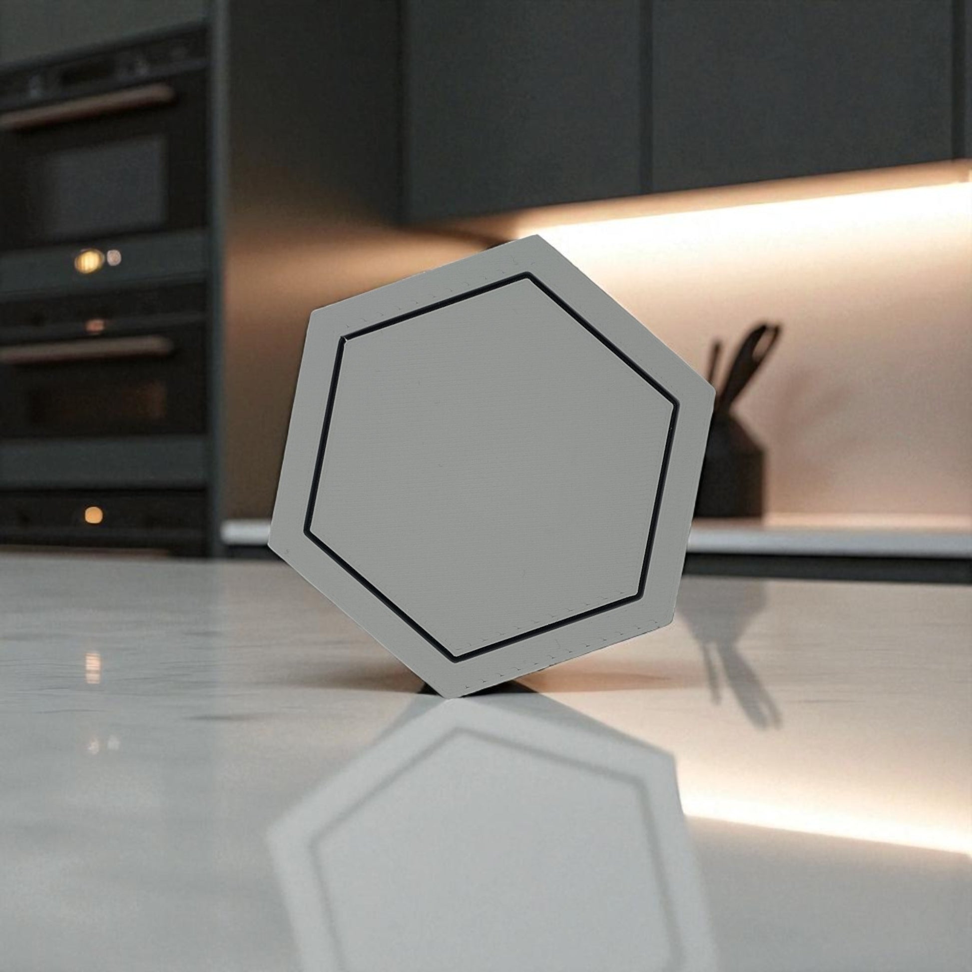 Modern hexagonal coaster in a minimalist design, measuring 115mm x 14mm, perfect for protecting surfaces from hot drinks. Available as a single piece, set of 4, or set of 6. Durable and stylish home decor accessory