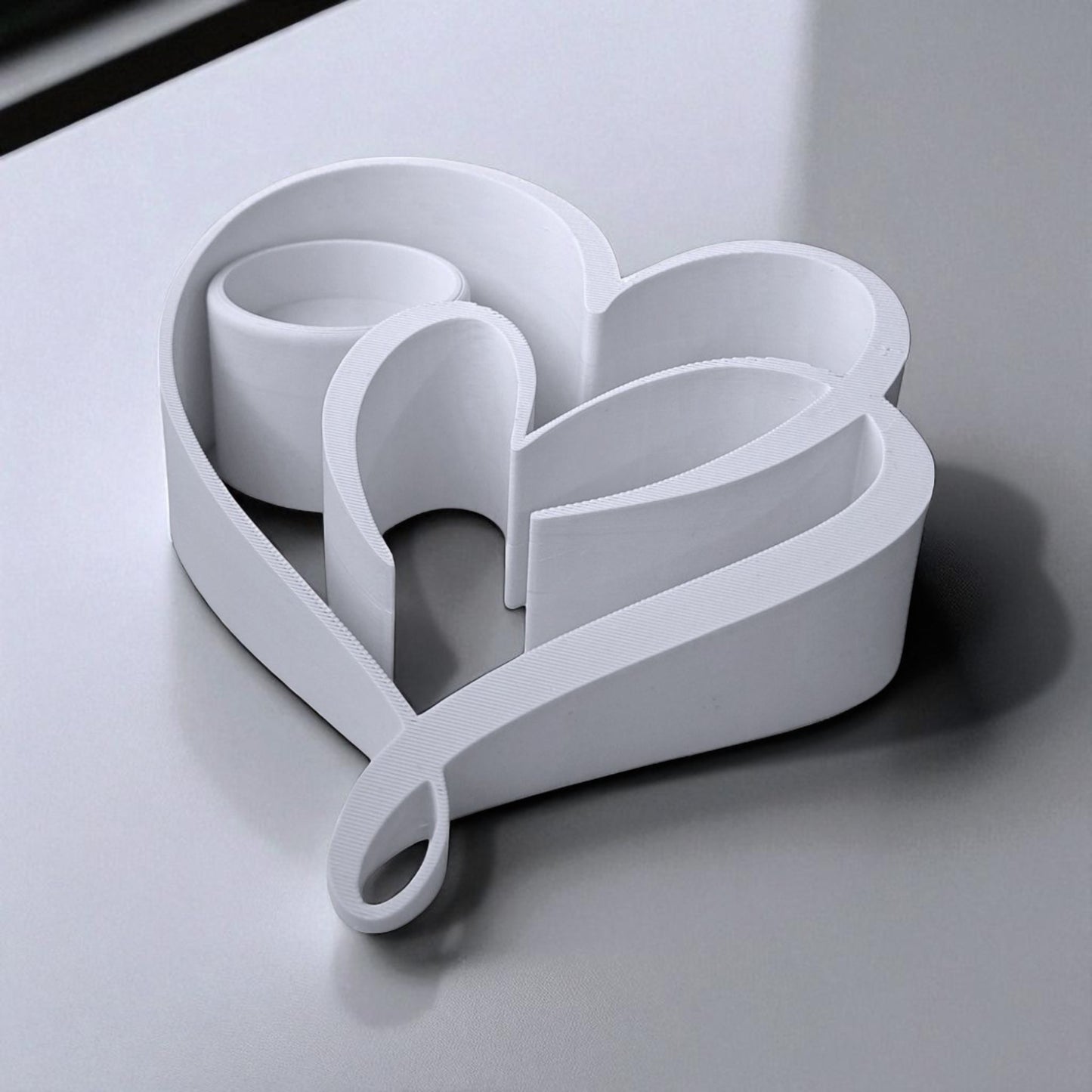 heart candle holder with a romantic double heart design, perfect for tealight candles and creating a warm, elegant ambiance for home decor or special occasions.