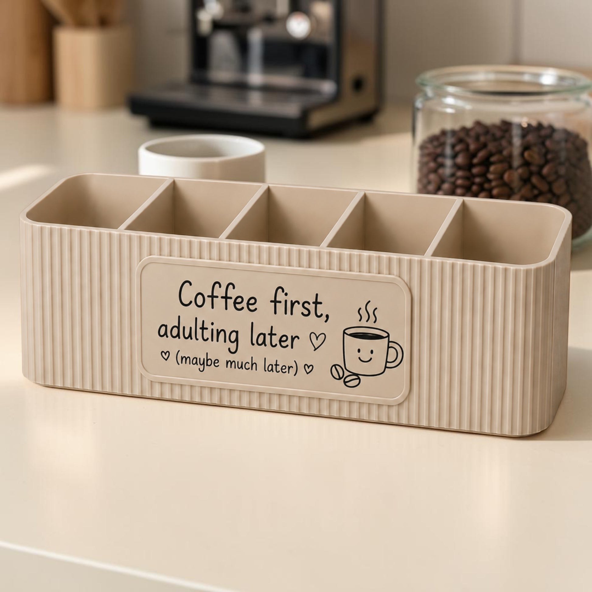 Personalised five compartment coffee station organiser with ribbed finish and custom UV printed front message, designed for storing coffee sachets, tea bags, sugar packets, creamer, spoons and stirrers on a kitchen countertop. Available in white, caramel, grey, pink, dark Blue Water and Lavender Purple.