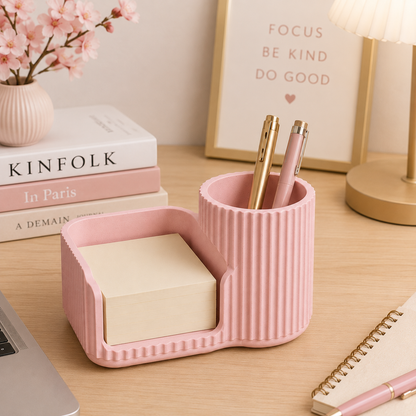 White sticky notes holder and pen organizer on a modern desk.
Black desk organizer with sticky note compartment and pen holder.
Grey desktop organizer holding sticky notes and pens.
Brown stationery organizer for office and study desks.
Caramel coloured desk accessory with pen cup and note holder.
Sakura pink sticky notes holder for cute desk decor.