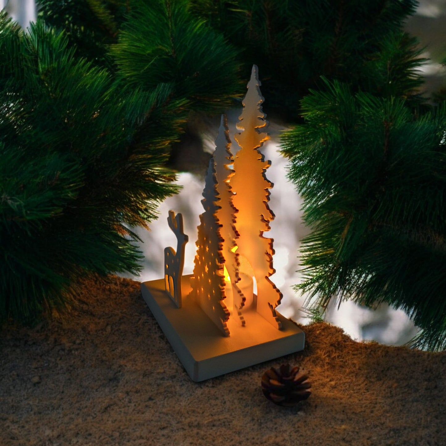 white christmas reindeer and pine tree led tealight decoration glowing on table, festive holiday décor for mantel or centerpiece.