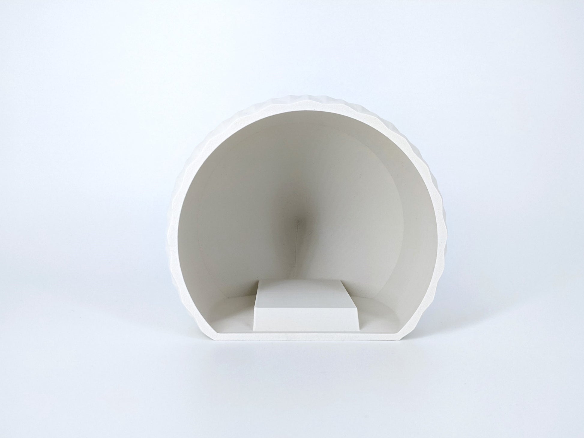 White ceramic bowl on a light gray background