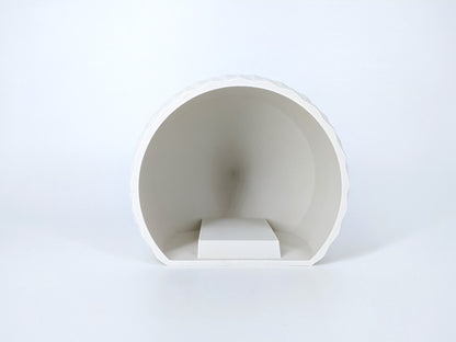 White ceramic bowl on a light gray background