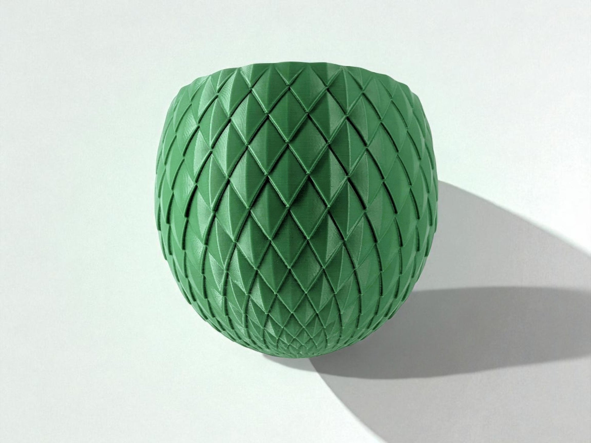 Wall-mounted planter named 'Egg Dragon,' featuring a unique egg shape. This versatile planter pot can be secured with screws or adhesive, adding a touch of greenery and style to any wall space