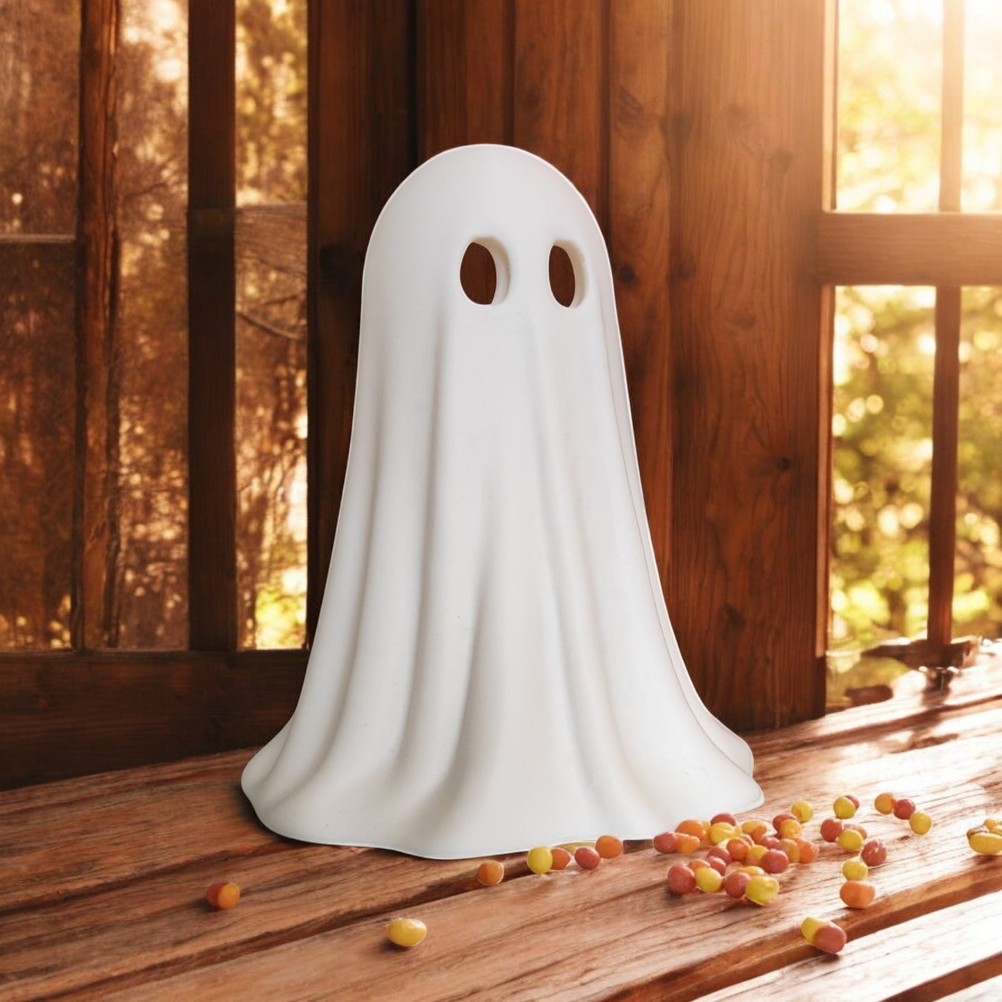 set of 3 glowing ghost led tealight holders in small, medium, and large sizes, for indoor or outdoor halloween decor.