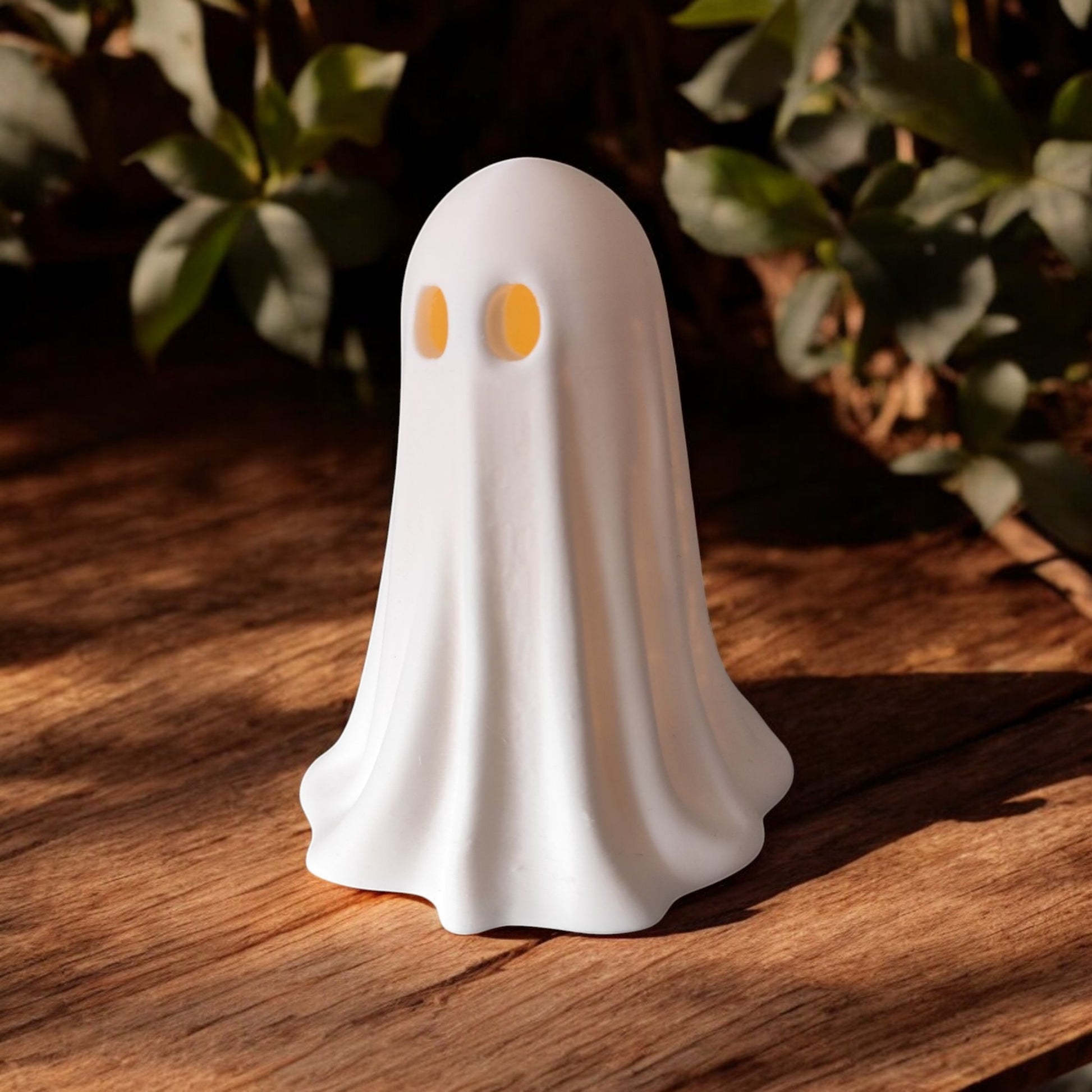 Set of 3 glowing ghost LED tealight holders in small, medium, and large sizes, for indoor or outdoor Halloween decor.