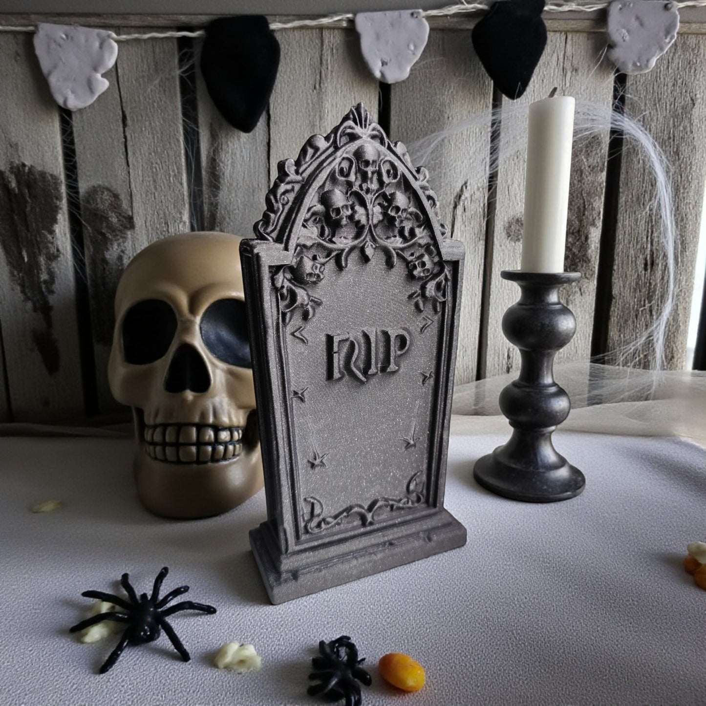 3d printed gothic gravestone with skull details and “rip” engraving, available in black, grey, and white, shown as halloween or gothic table decor.