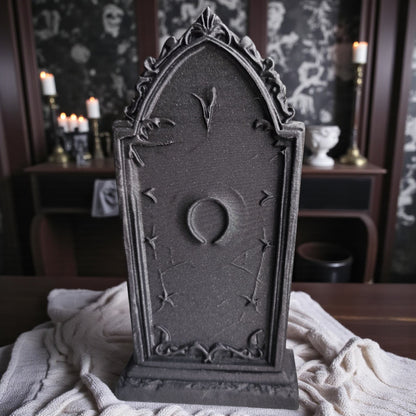 3D printed gothic gravestone with skull details and “RIP” engraving, available in black, grey, and white, shown as Halloween or gothic table decor.