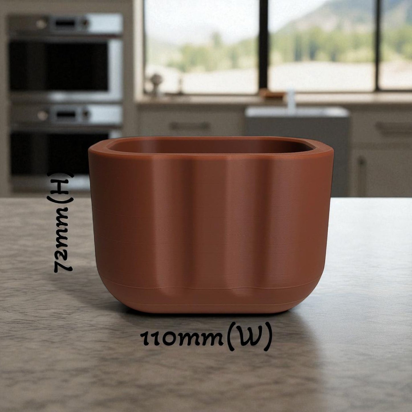 black sponge holder with a yellow sponge on a kitchen counter