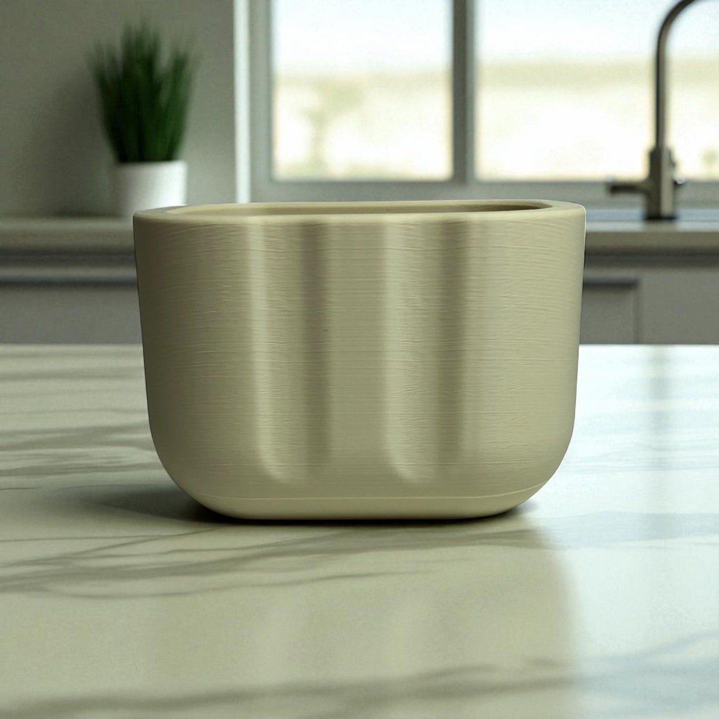 black sponge holder with a yellow sponge on a kitchen counter