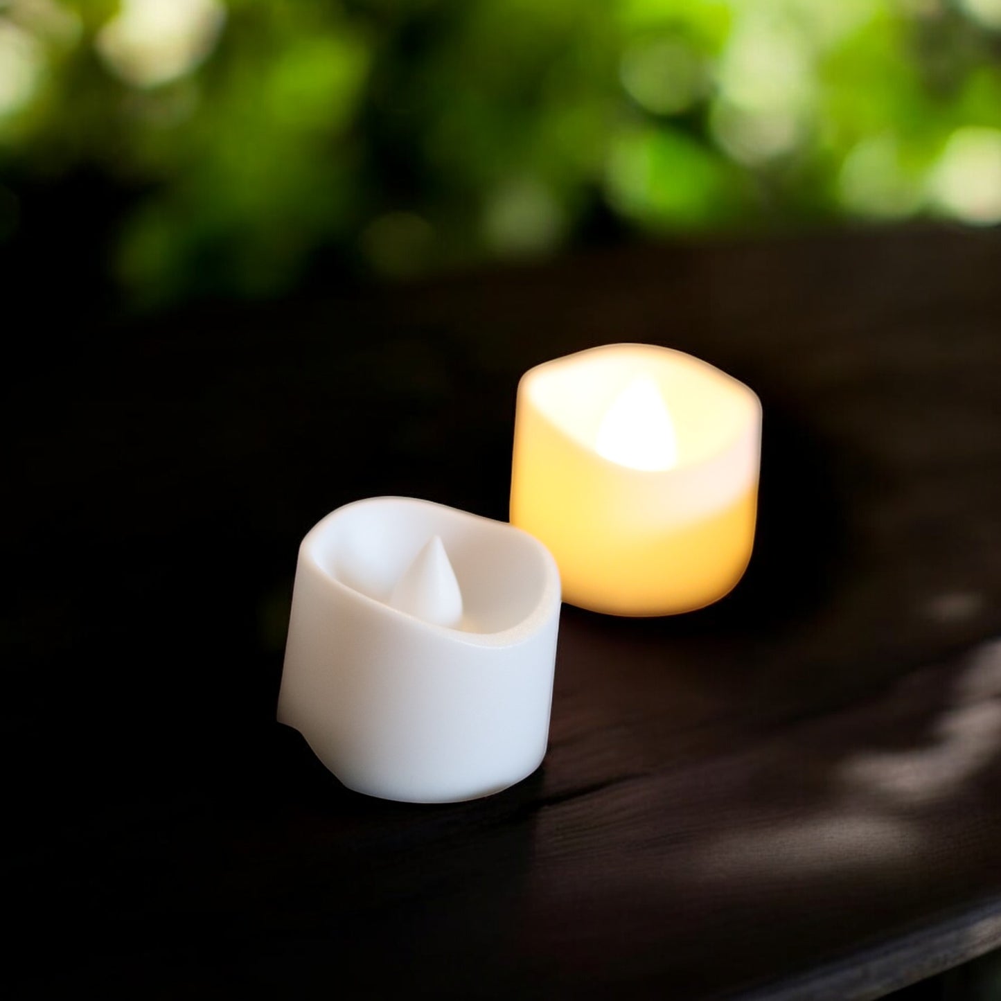 set of 3 glowing ghost led tealight holders in small, medium, and large sizes, for indoor or outdoor halloween decor.