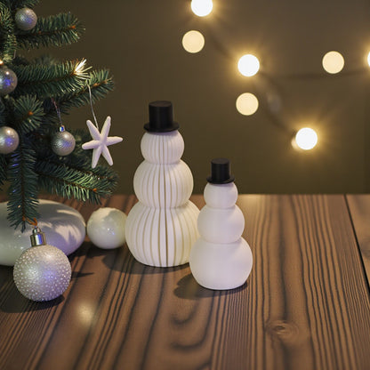 Two white snowman figurines, one ribbed and one smooth, each with a small black top hat. Minimalist Christmas decor displayed on a countertop in small and large sizes.