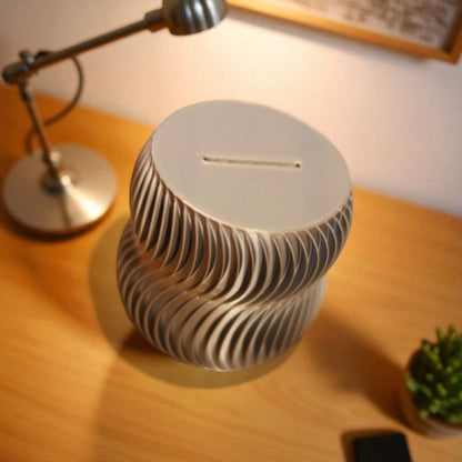  luxury coin bank designed to turn saving into a sophisticated experience. Available in two different sizes, this stylish coin bank seamlessly blends form and function, making it the perfect addition to any home or office. 