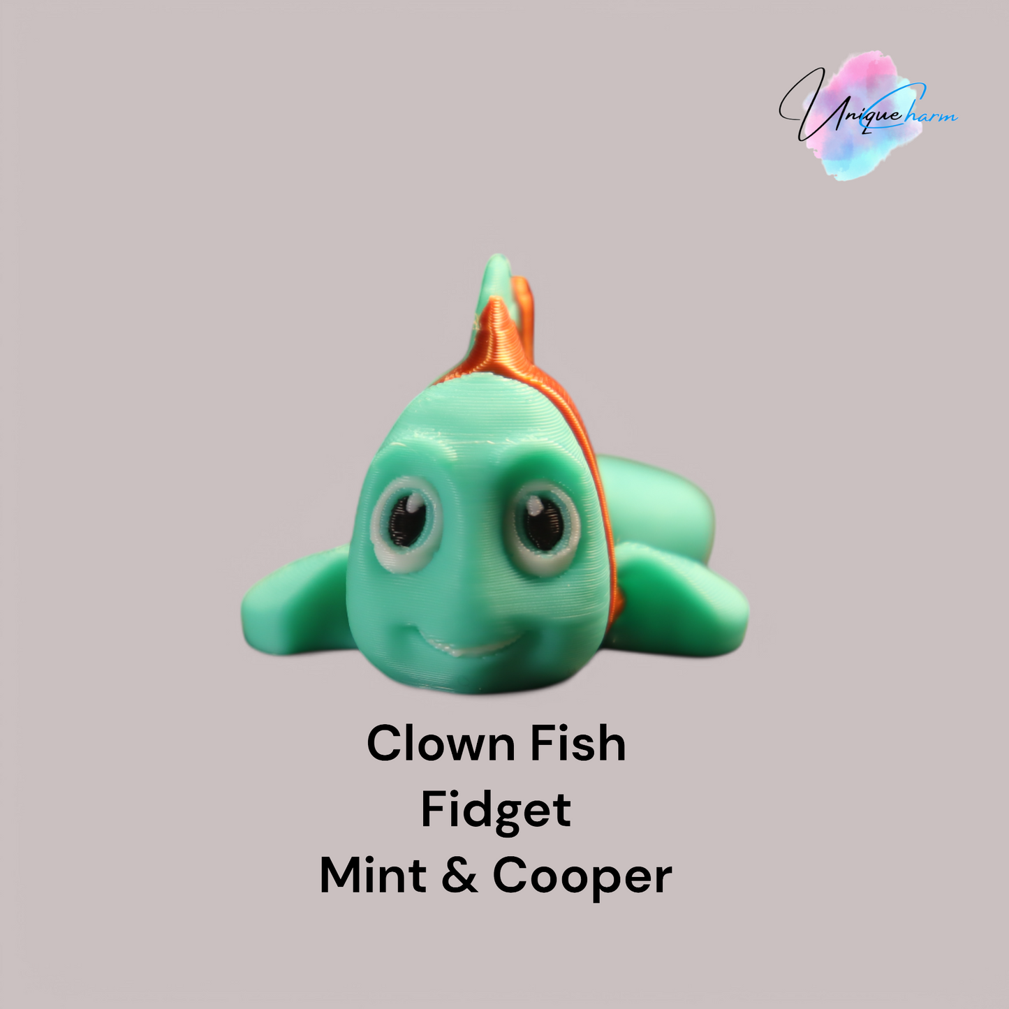 3d printed articulated clown fish toy in vibrant two-tone colors, featuring a cute face and flexible, lifelike movement, perfect as a keychain or playful ocean-themed gift.