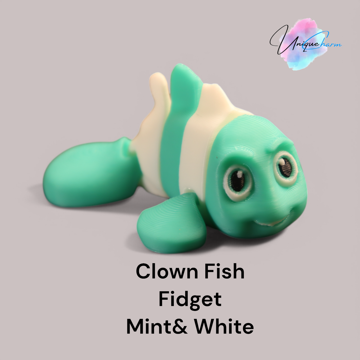 3d printed articulated clown fish toy in vibrant two-tone colors, featuring a cute face and flexible, lifelike movement, perfect as a keychain or playful ocean-themed gift.