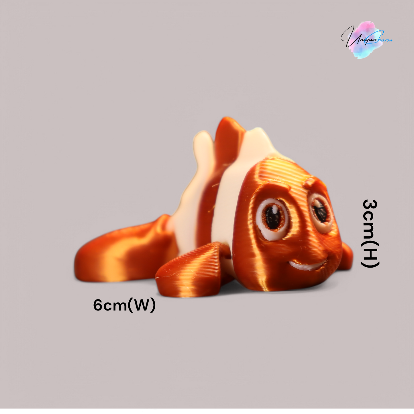 3d printed articulated clown fish toy in vibrant two-tone colors, featuring a cute face and flexible, lifelike movement, perfect as a keychain or playful ocean-themed gift.