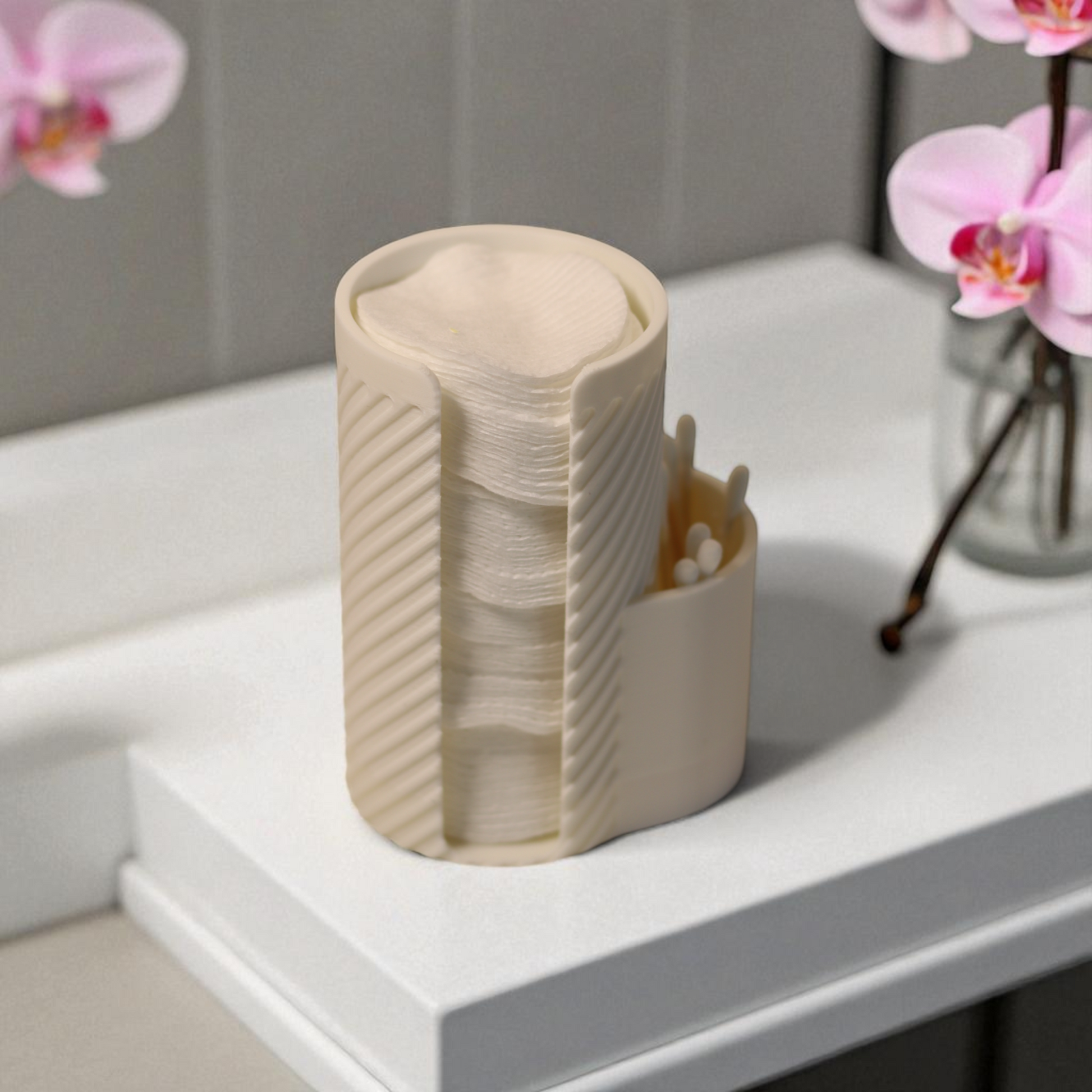 White makeup cotton pad holder with side cup for cotton buds on a vanity; minimal bathroom organizer for cotton rounds and Q-tips.