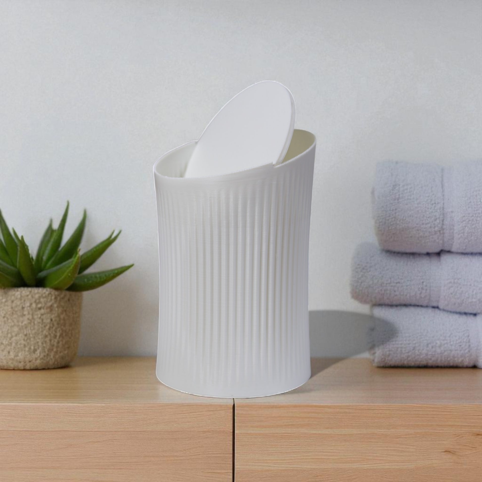 Small trash can for cotton pads, tissues, and desk clutter, minimalist design