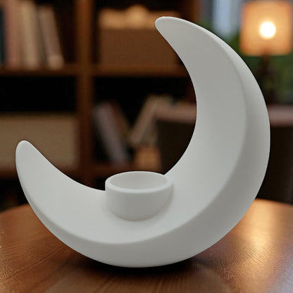 An elegant moon-inspired centerpiece with a celestial design, perfect for adding a touch of sophistication and romance to any space. This stunning decor piece captures the serene beauty of the moon, making it an ideal statement for tables, shelves, or special occasions.