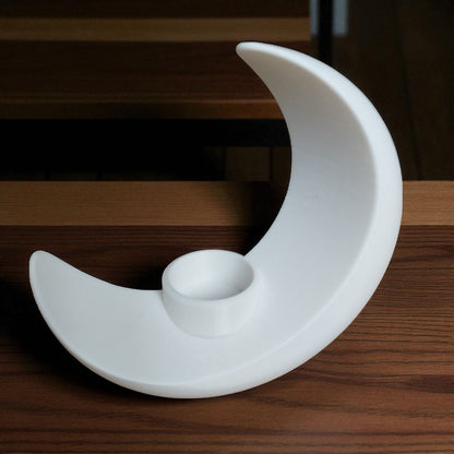 An elegant moon-inspired centerpiece with a celestial design, perfect for adding a touch of sophistication and romance to any space. This stunning decor piece captures the serene beauty of the moon, making it an ideal statement for tables, shelves, or special occasions.