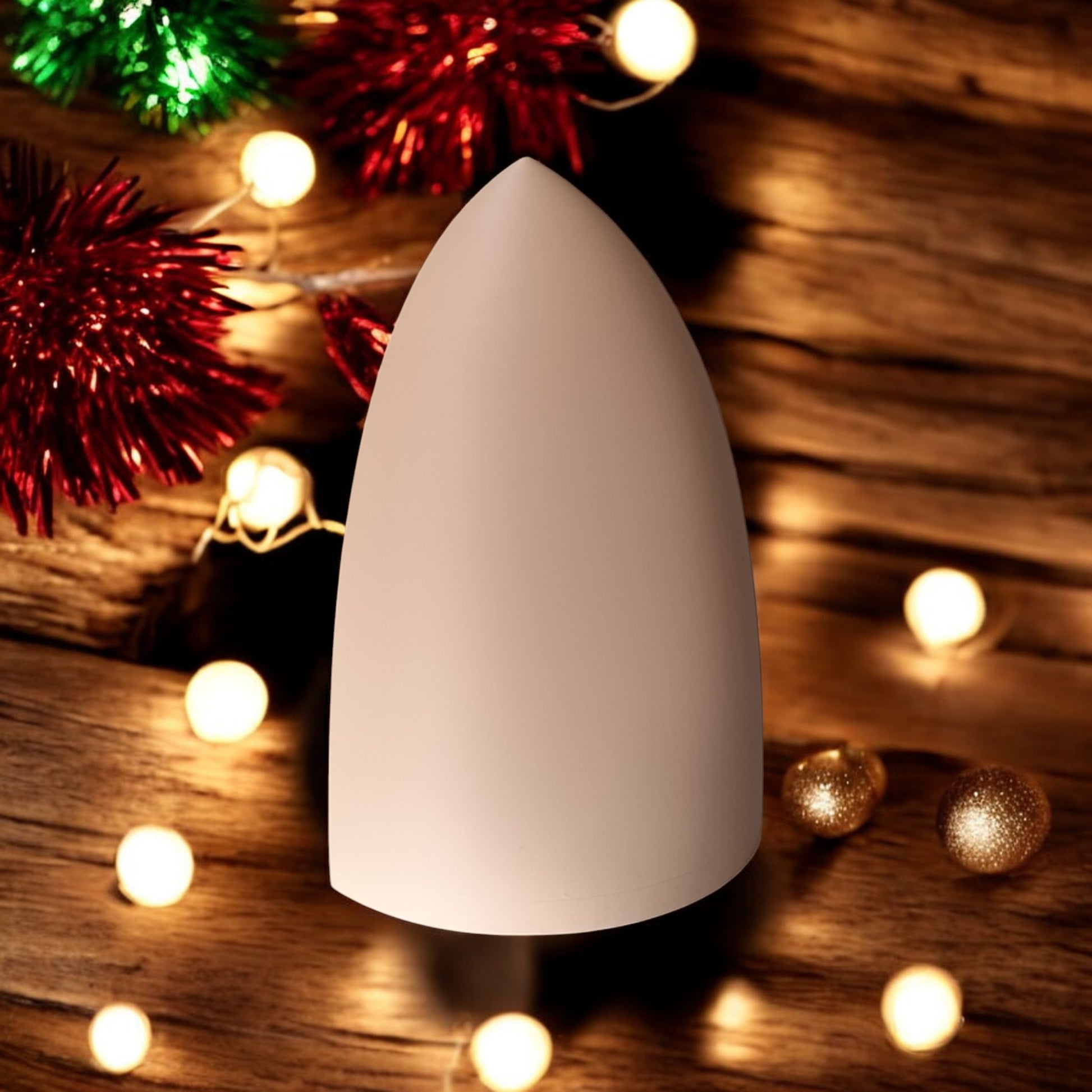 Handmade nativity scene decoration displayed with a stable silhouette, Holy Family figures, star on top and optional LED tealight, shown in a soft neutral colour. Modern Christmas home décor piece measuring 28.5 cm tall, 19 cm wide and 10 cm deep