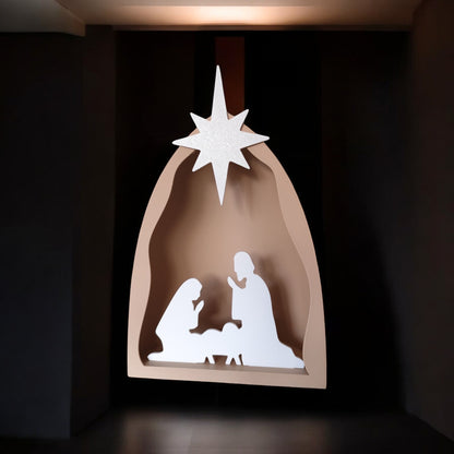 Handmade nativity scene decoration displayed with a stable silhouette, Holy Family figures, star on top and optional LED tealight, shown in a soft neutral colour. Modern Christmas home décor piece measuring 28.5 cm tall, 19 cm wide and 10 cm deep