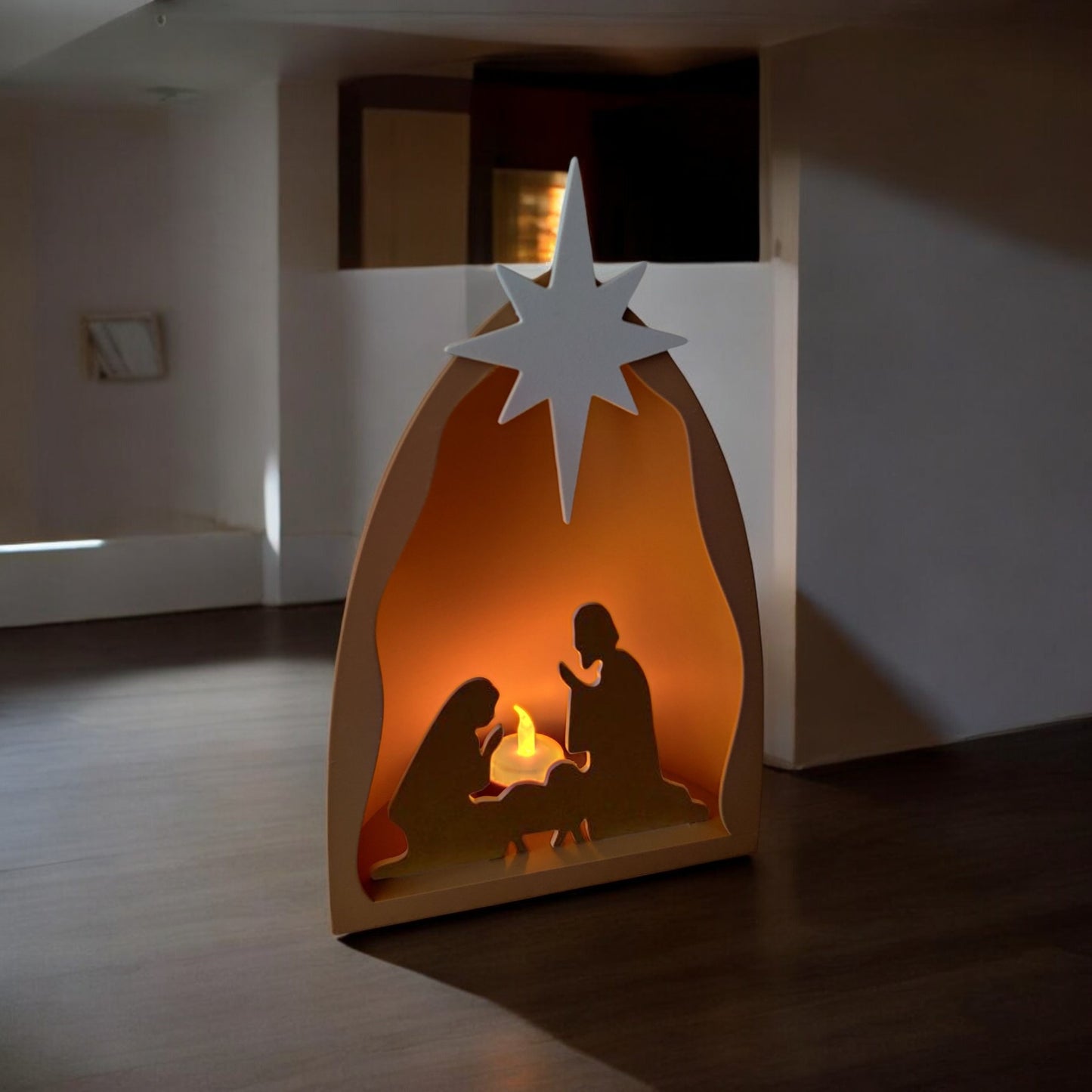 handmade nativity scene decoration displayed with a stable silhouette, holy family figures, star on top and optional led tealight, shown in a soft neutral colour. modern christmas home décor piece measuring 28.5 cm tall, 19 cm wide and 10 cm deep
