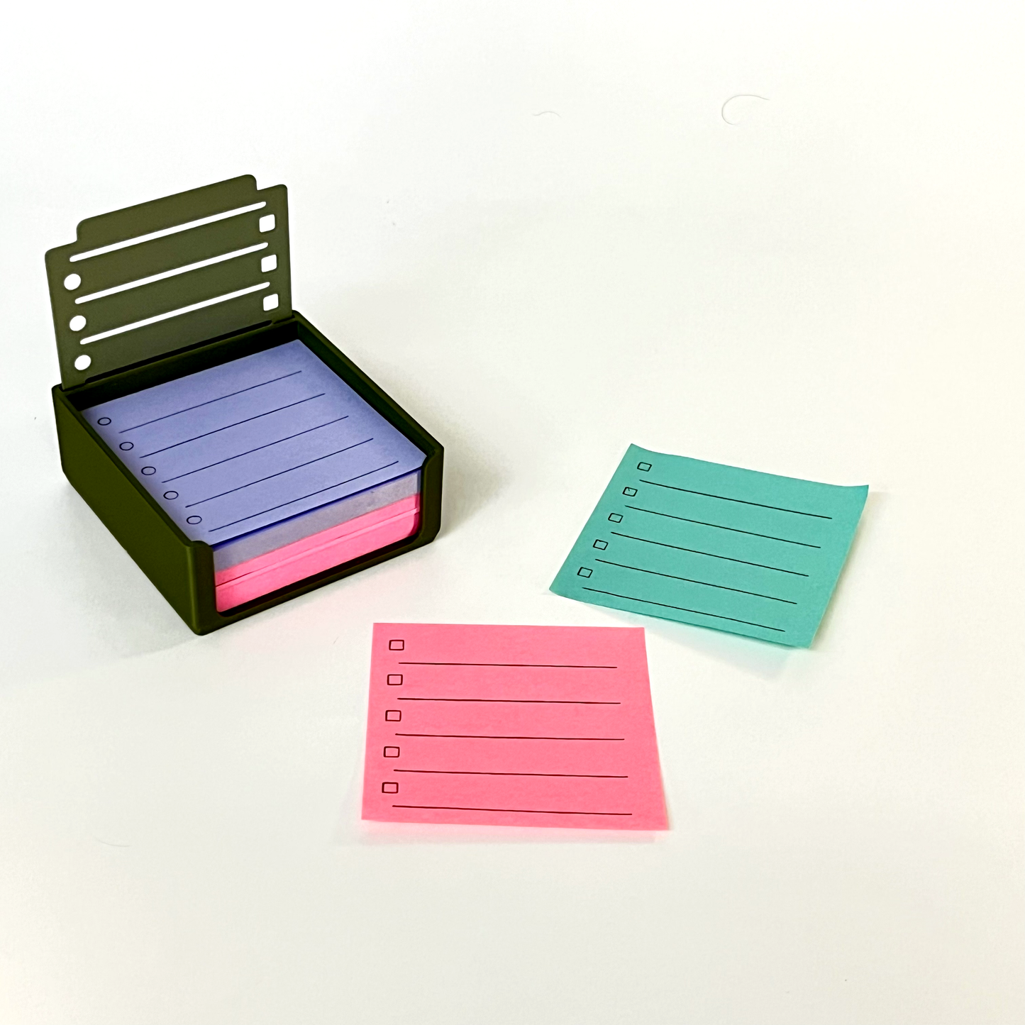 3d-printed sticky note holder and stencil in a sleek, modern design. holds 3x3” sticky notes securely while providing stencil guides for perfectly straight lines. ideal for neat handwriting, journaling, and office organization