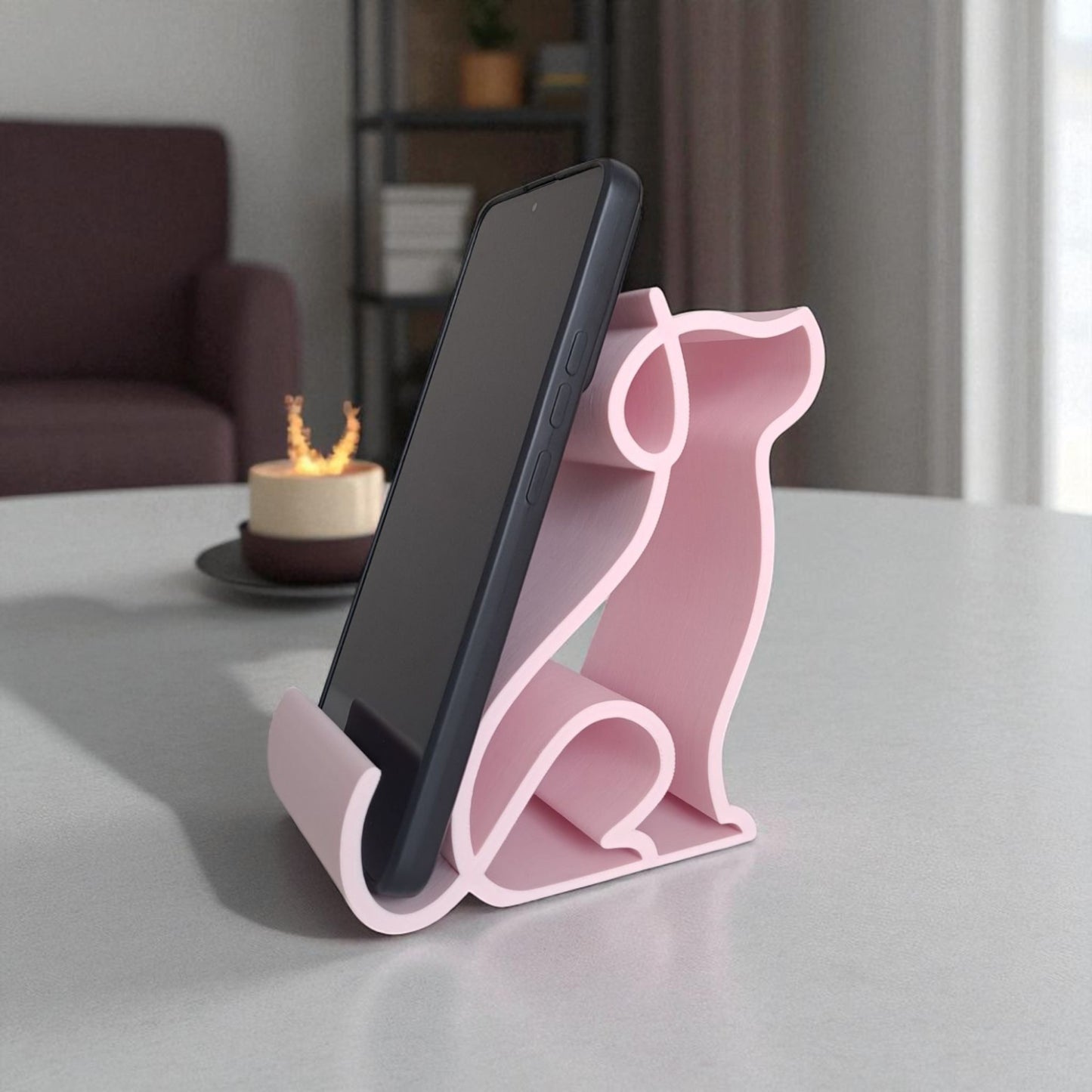 3d printed pink dog-shaped phone holder for desk, used to support a smartphone, tablet, or kindle, ideal for pet lovers and home office decor