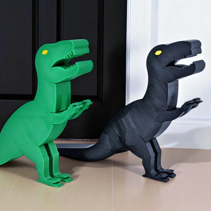 Green and black dinosaur door stoppers on a wooden floor.