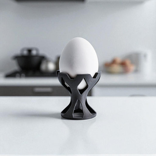 Elegant egg holder named 'EGG CROWN,' designed for a stylish presentation on the breakfast table. This unique egg stand adds a touch of sophistication to any meal, perfect for enjoying eggs in a refined and practical way