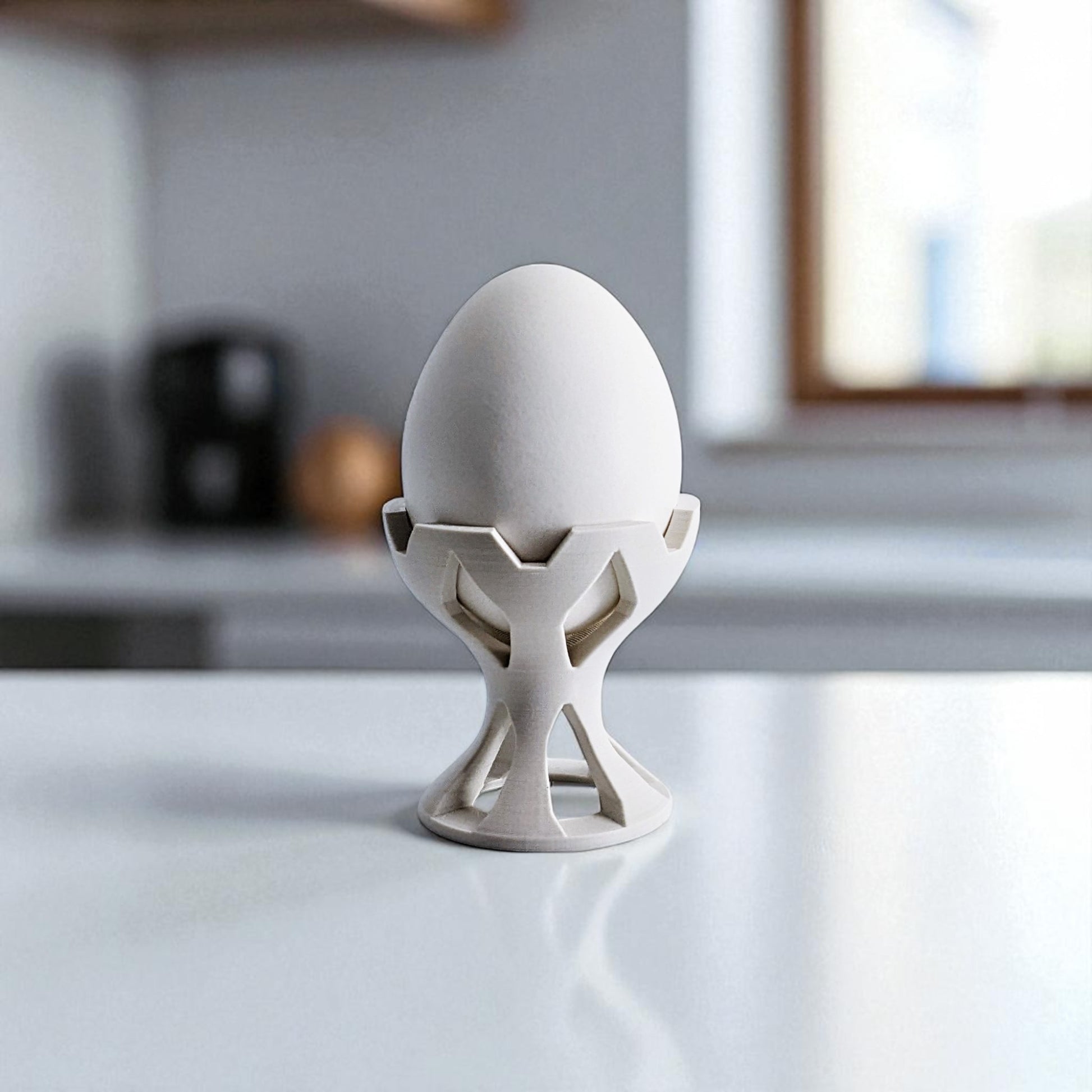 Elegant egg holder named 'EGG CROWN,' designed for a stylish presentation on the breakfast table. This unique egg stand adds a touch of sophistication to any meal, perfect for enjoying eggs in a refined and practical way
