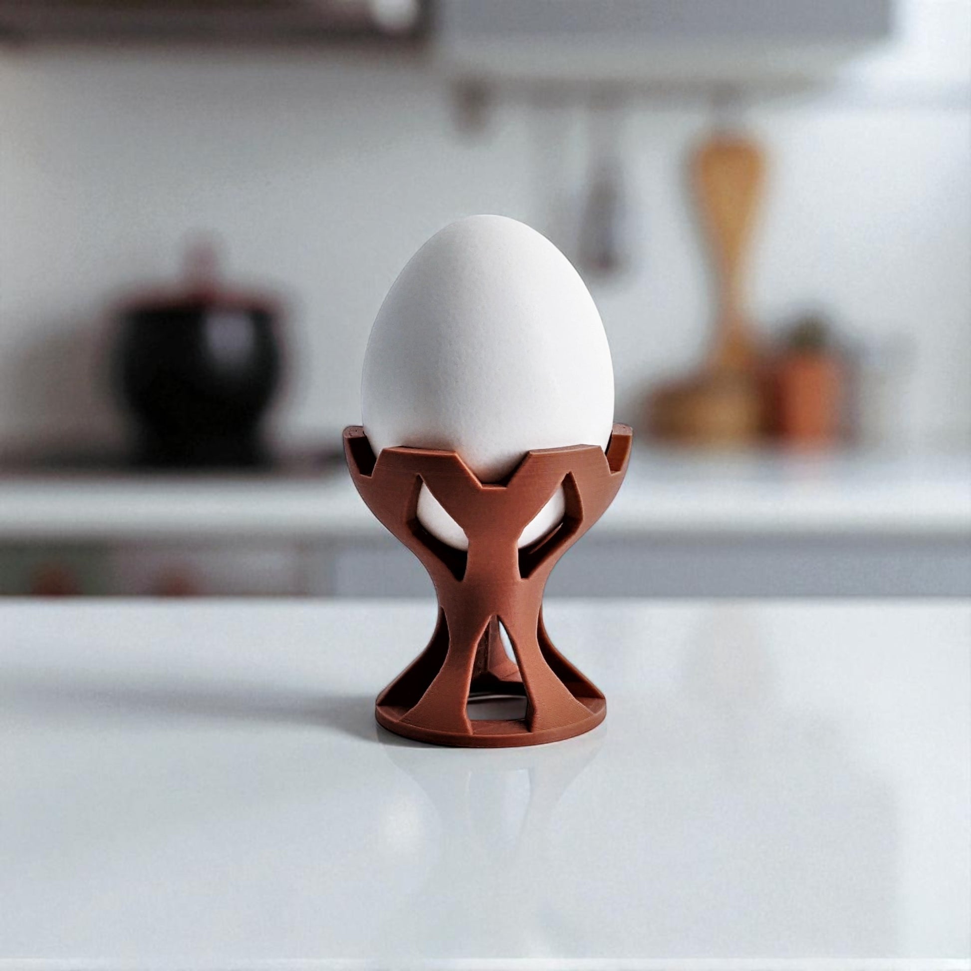 Elegant egg holder named 'EGG CROWN,' designed for a stylish presentation on the breakfast table. This unique egg stand adds a touch of sophistication to any meal, perfect for enjoying eggs in a refined and practical way