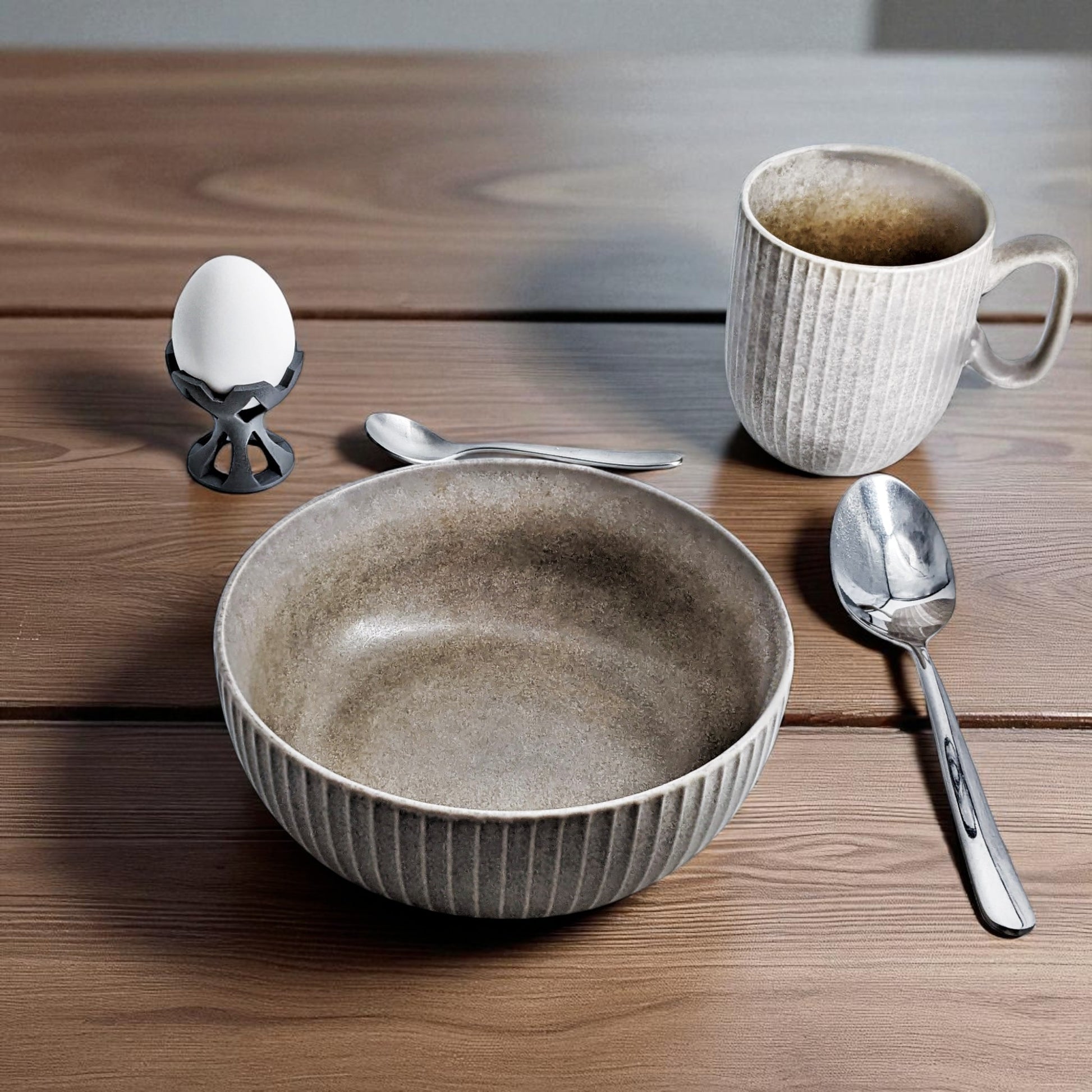 Elegant egg holder named 'EGG CROWN,' designed for a stylish presentation on the breakfast table. This unique egg stand adds a touch of sophistication to any meal, perfect for enjoying eggs in a refined and practical way