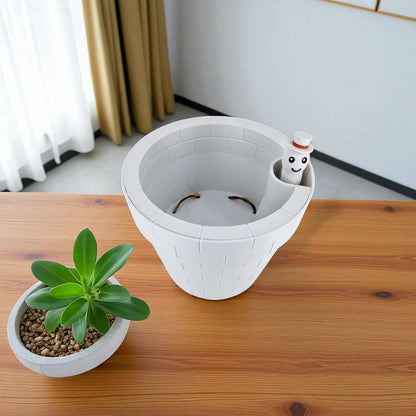 A clever and charming Worm Rise Planter featuring a worm-shaped water indicator that rises to signal when the plant has enough water. Perfect for plant lovers who value functionality and fun design