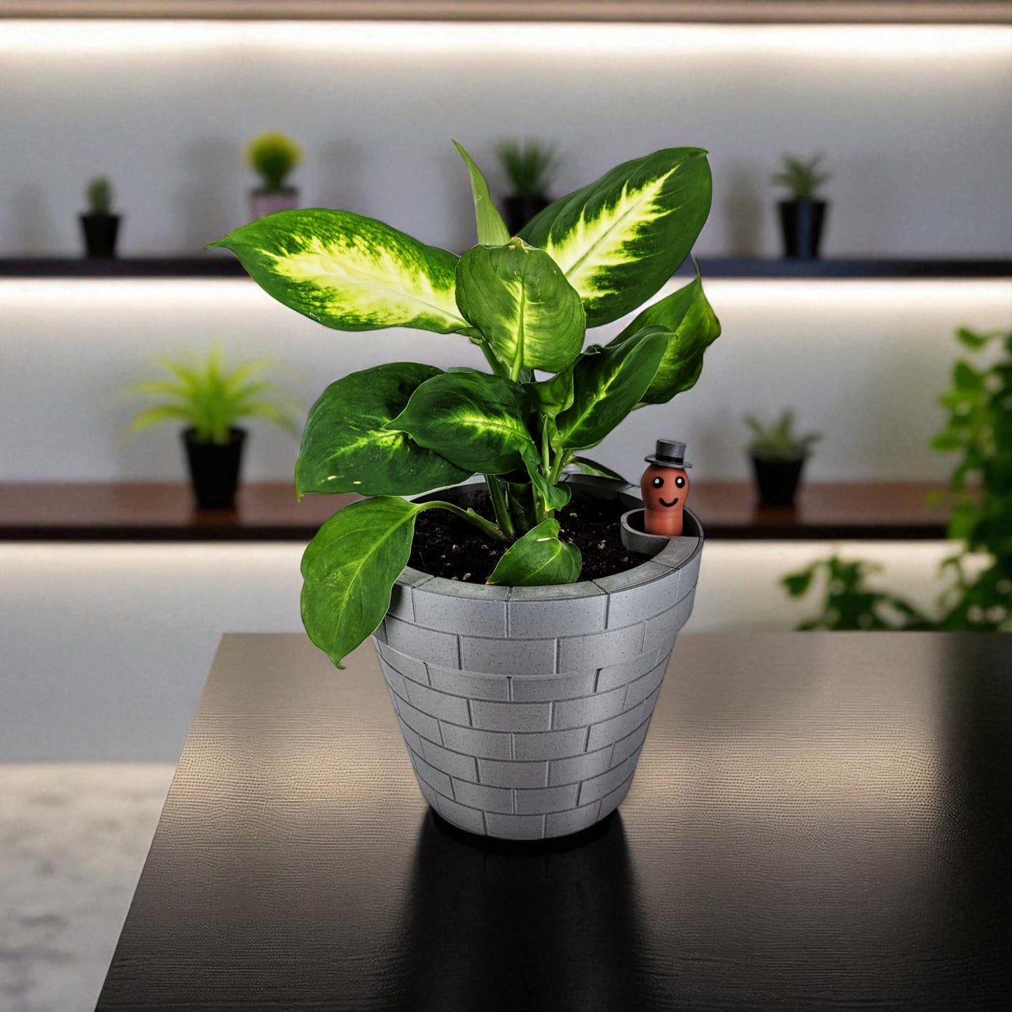 a clever and charming worm rise planter featuring a worm-shaped water indicator that rises to signal when the plant has enough water. perfect for plant lovers who value functionality and fun design