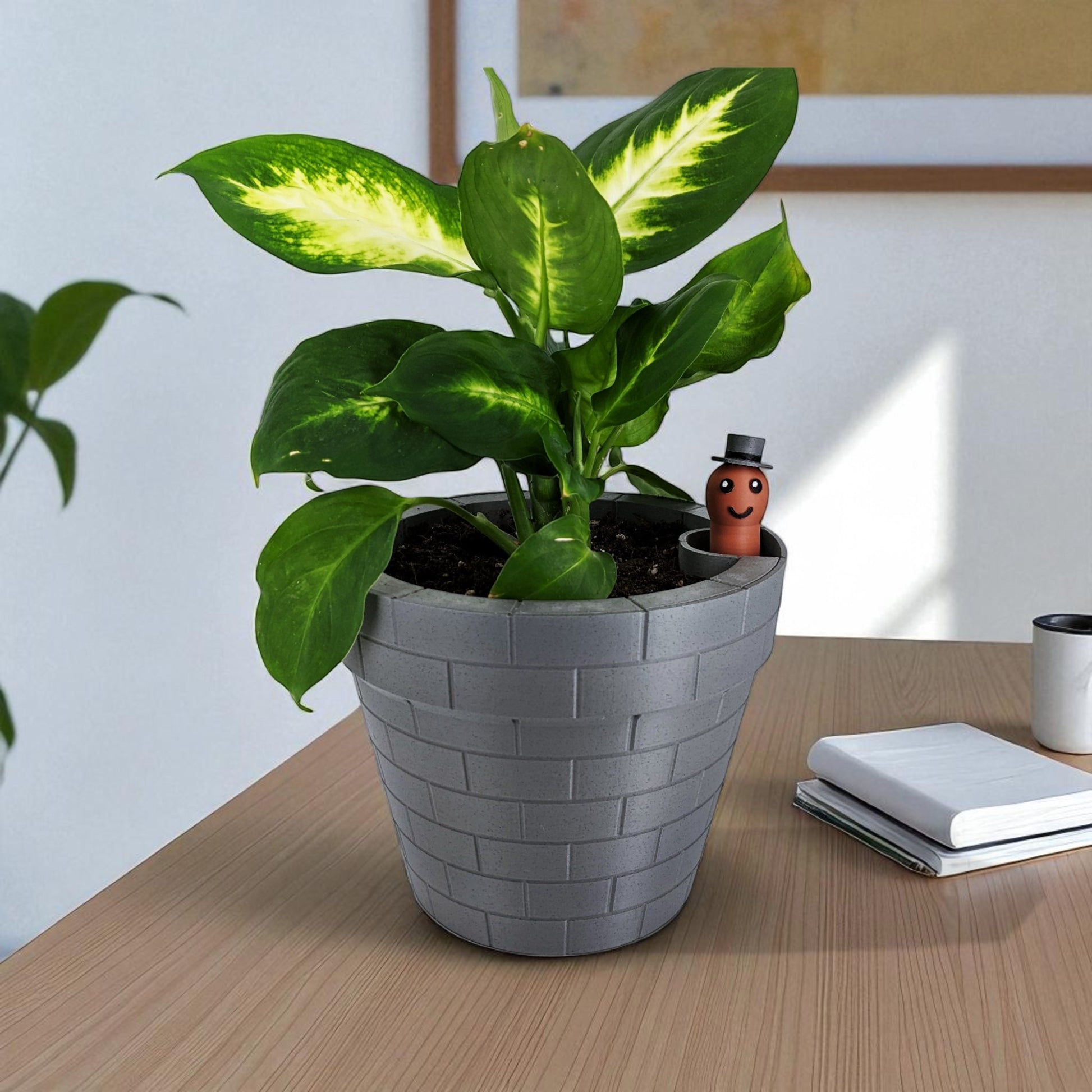 A clever and charming Worm Rise Planter featuring a worm-shaped water indicator that rises to signal when the plant has enough water. Perfect for plant lovers who value functionality and fun design