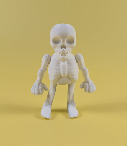 White 3D-printed skeleton figurine raising both arms on a yellow background; spooky-cute desk buddy with lightly poseable joints.