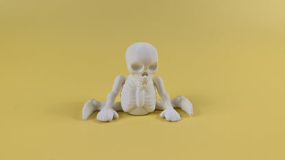 White 3D-printed skeleton figurine raising both arms on a yellow background; spooky-cute desk buddy with lightly poseable joints.